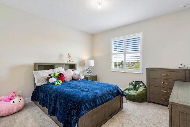 983 Hookline Cir, The Acreage, FL 33470 - bedroom with light carpet and baseboards