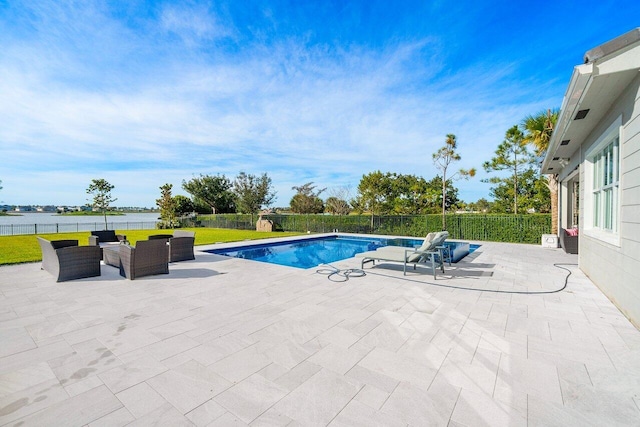983 Hookline Cir, The Acreage, FL 33470 - view of pool featuring a patio area, an outdoor hangout area, and a water view