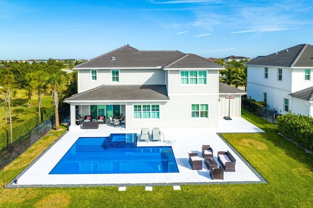 983 Hookline Cir, The Acreage, FL 33470 - rear view of house with outdoor lounge area and a patio