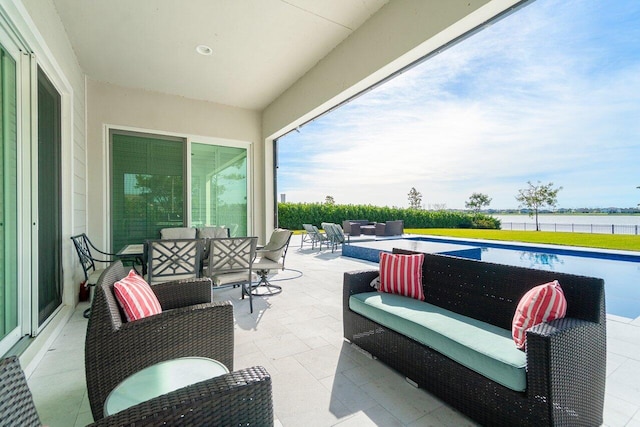 983 Hookline Cir, The Acreage, FL 33470 - view of patio / terrace featuring an outdoor hangout area and a water view