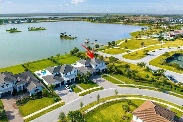 983 Hookline Cir, The Acreage, FL 33470 - aerial perspective of suburban area with a large body of water