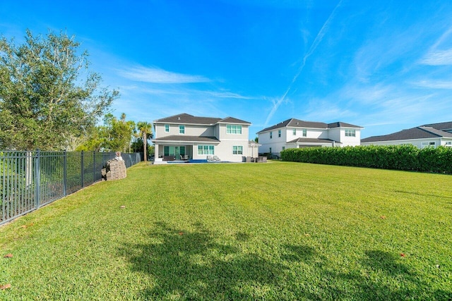 983 Hookline Cir, The Acreage, FL 33470 - back of property featuring a patio area