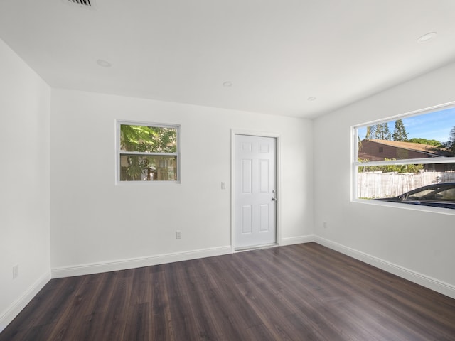4107 Virginia Ter, West Palm Beach, FL 33405 - unfurnished room with plenty of natural light, dark wood finished floors, and baseboards