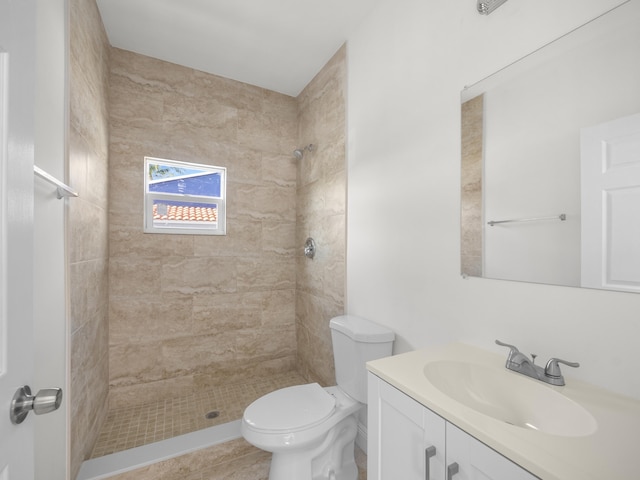 4107 Virginia Ter, West Palm Beach, FL 33405 - bathroom featuring vanity, toilet, and tiled shower