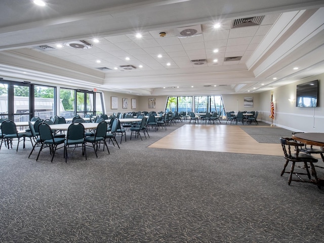1800 SE St Lucie Blvd Unit 12-102, Stuart, FL 34996 - carpeted dining area with crown molding, a raised ceiling, and recessed lighting