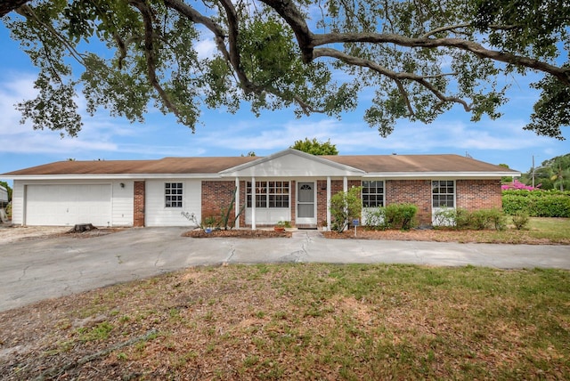 201 Rex Ct, Palm Springs, FL 33461 - single story home featuring brick siding, an attached garage, and concrete driveway