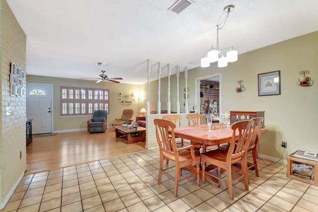 201 Rex Ct, Palm Springs, FL 33461 - dining space featuring ceiling fan, a chandelier, and light tile patterned floors