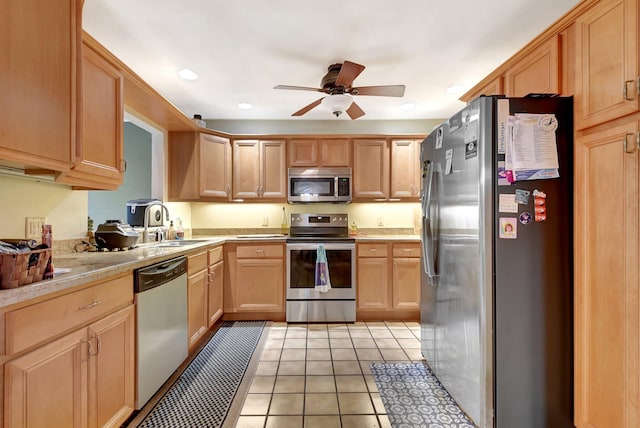 201 Rex Ct, Palm Springs, FL 33461 - kitchen featuring appliances with stainless steel finishes, light countertops, ceiling fan, light brown cabinetry, and light tile patterned flooring