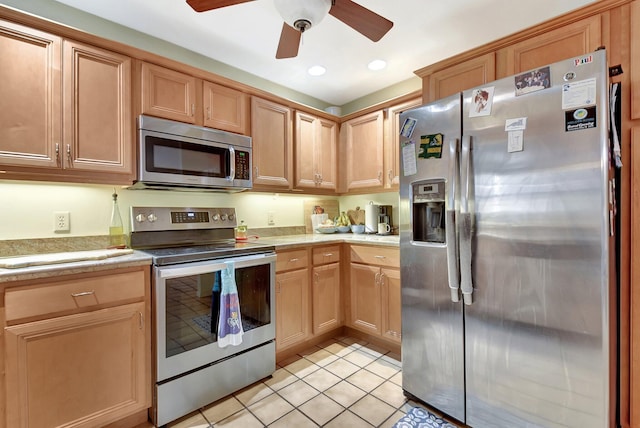 201 Rex Ct, Palm Springs, FL 33461 - kitchen with stainless steel appliances, light countertops, ceiling fan, light tile patterned flooring, and recessed lighting