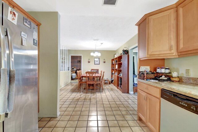 201 Rex Ct, Palm Springs, FL 33461 - kitchen with dishwasher, freestanding refrigerator, light brown cabinets, light tile patterned floors, and a chandelier