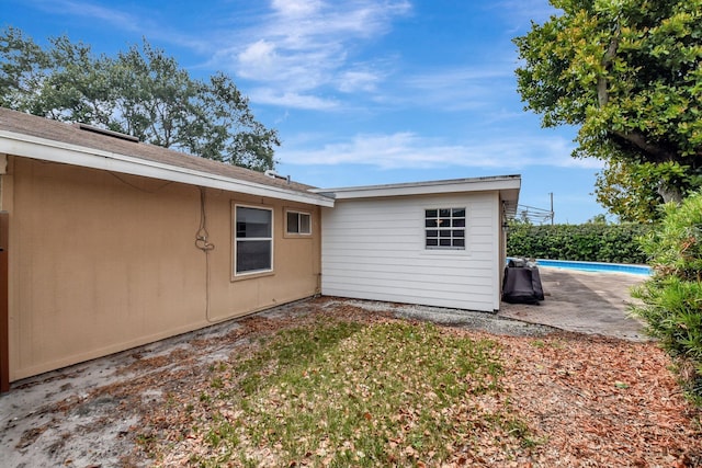 201 Rex Ct, Palm Springs, FL 33461 - back of house with a patio area and roof with shingles