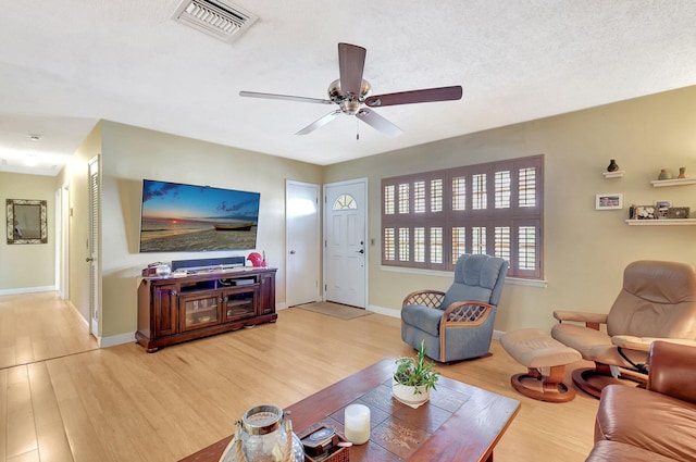 201 Rex Ct, Palm Springs, FL 33461 - living room with light wood-style floors and a ceiling fan