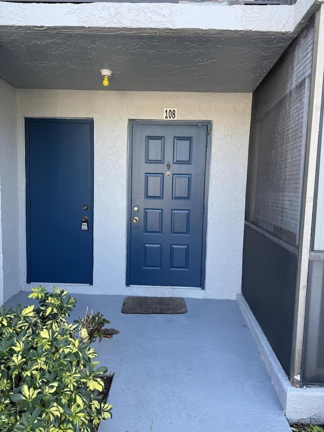 7535 S Orile Blvd Unit 108, Delray Beach, FL 33446 - view of exterior entry featuring stucco siding
