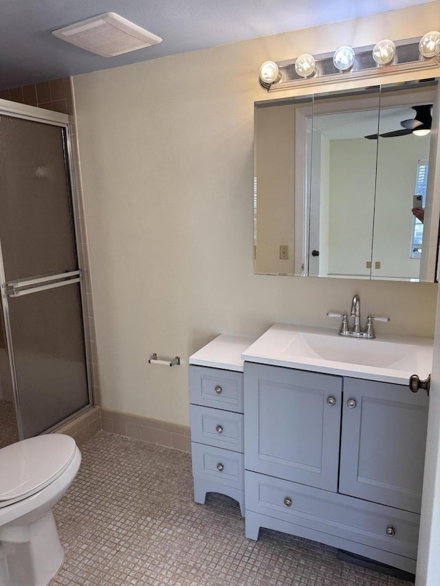 7535 S Orile Blvd Unit 108, Delray Beach, FL 33446 - bathroom with a shower with shower door, vanity, toilet, and tile patterned flooring