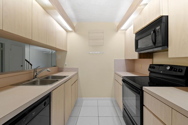 1602 16th Ct Unit 48D, Jupiter, FL 33477 - kitchen with black appliances, a sink, light brown cabinets, light tile patterned flooring, and light countertops