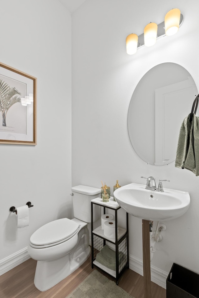 10803 Stellar Cir, Palm Beach Gardens, FL 33412 - bathroom with wood finished floors, toilet, and baseboards
