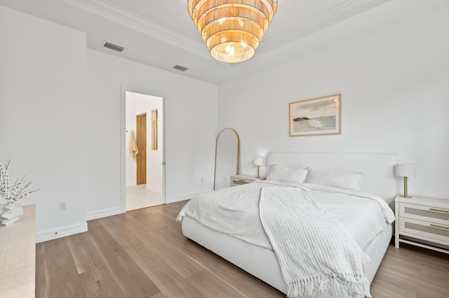 10803 Stellar Cir, Palm Beach Gardens, FL 33412 - bedroom with crown molding, wood finished floors, and baseboards