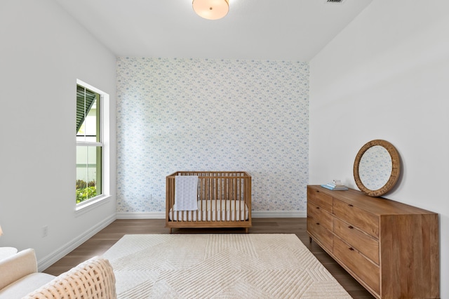10803 Stellar Cir, Palm Beach Gardens, FL 33412 - bedroom with wood finished floors, baseboards, and wallpapered walls