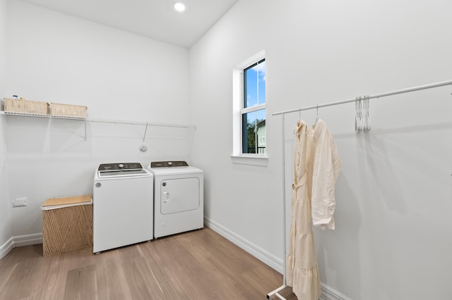 10803 Stellar Cir, Palm Beach Gardens, FL 33412 - washroom featuring independent washer and dryer, light wood finished floors, and baseboards
