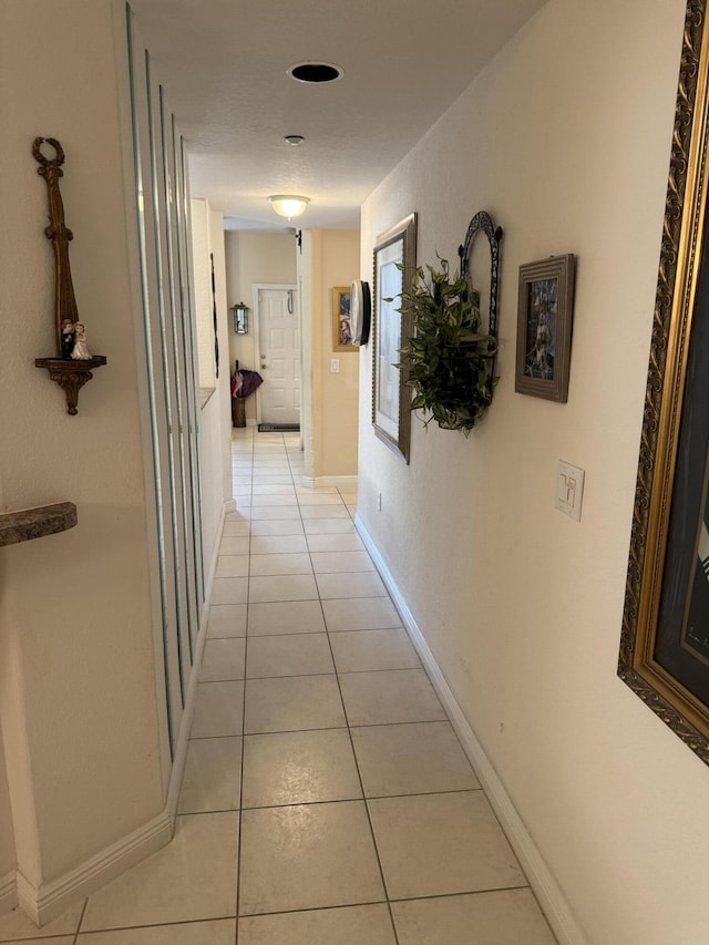 7715 Southampton Ter Unit 102, Tamarac, FL 33321 - corridor with light tile patterned flooring and baseboards