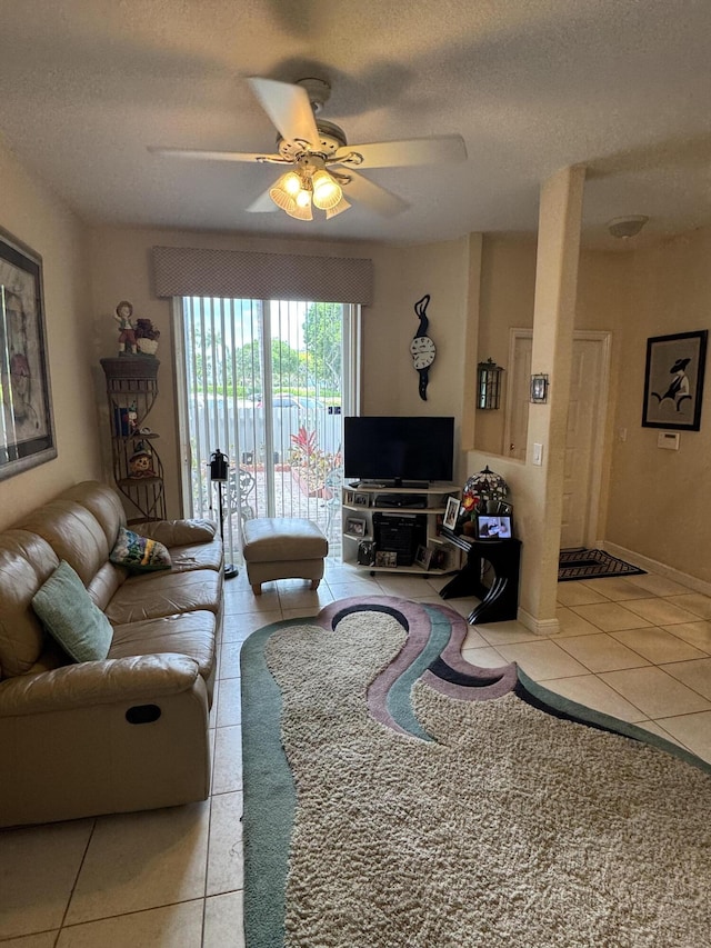 7715 Southampton Ter Unit 102, Tamarac, FL 33321 - tiled living area with ceiling fan and a textured ceiling