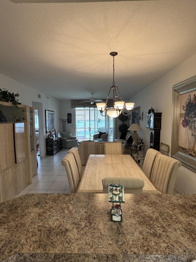 7715 Southampton Ter Unit 102, Tamarac, FL 33321 - dining space featuring a chandelier and light tile patterned flooring