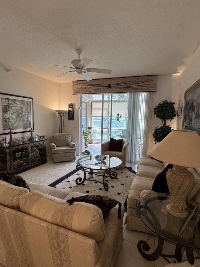 7715 Southampton Ter Unit 102, Tamarac, FL 33321 - living room with a textured ceiling, a ceiling fan, and light tile patterned floors