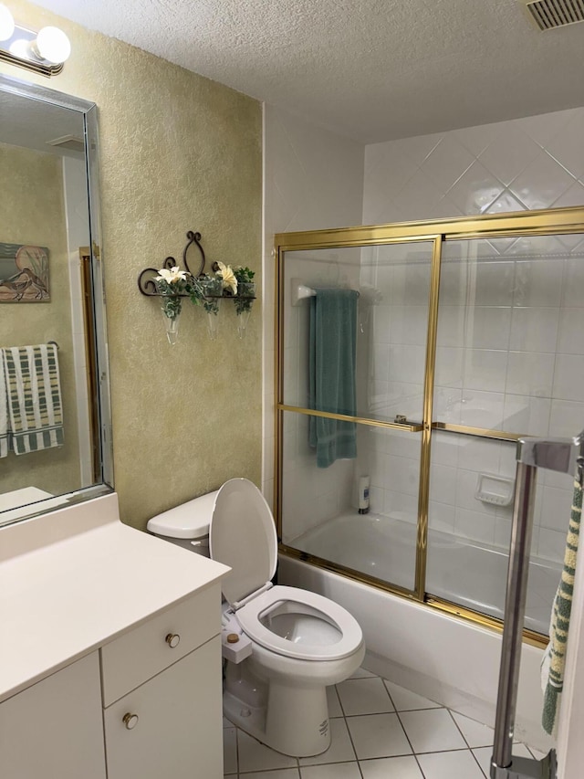 7715 Southampton Ter Unit 102, Tamarac, FL 33321 - full bathroom featuring a textured wall, a textured ceiling, vanity, shower / bath combination with glass door, and tile patterned flooring