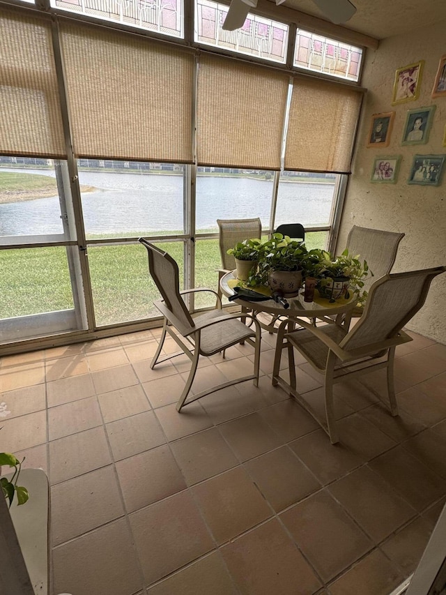7715 Southampton Ter Unit 102, Tamarac, FL 33321 - sunroom featuring a water view and a ceiling fan