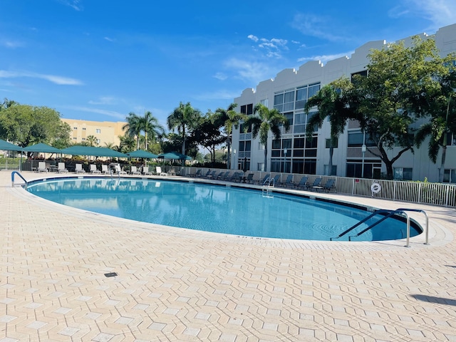 7715 Southampton Ter Unit 102, Tamarac, FL 33321 - community pool featuring a patio area