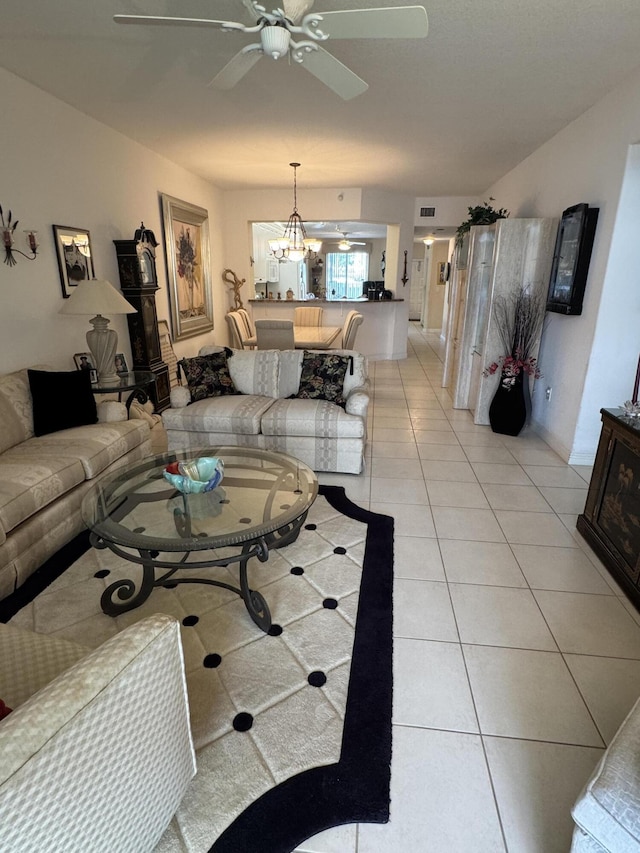 7715 Southampton Ter Unit 102, Tamarac, FL 33321 - living room with a ceiling fan, light tile patterned flooring, and a chandelier