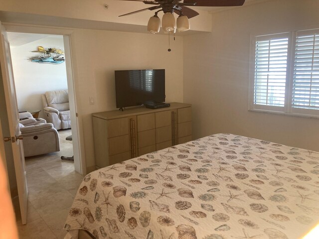 1401 Tidal Pointe Blvd Unit 102, Jupiter, FL 33477 - bedroom with light tile patterned floors and ceiling fan