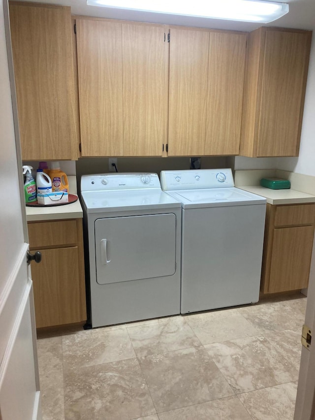 1401 Tidal Pointe Blvd Unit 102, Jupiter, FL 33477 - laundry area with washing machine and dryer and cabinet space