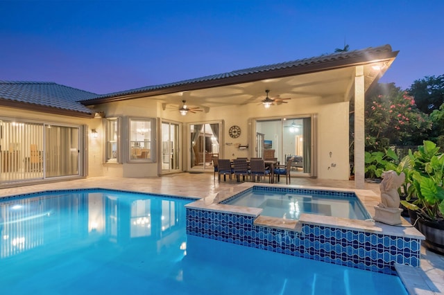 4610 Bucida Rd, Boynton Beach, FL 33436 - rear view of property with ceiling fan, stucco siding, an in-ground hot tub, a patio area, and a tiled roof