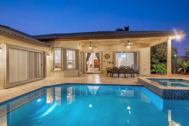4610 Bucida Rd, Boynton Beach, FL 33436 - pool at twilight featuring a ceiling fan, a patio area, and a pool with connected hot tub