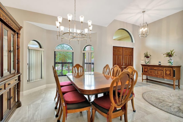 4610 Bucida Rd, Boynton Beach, FL 33436 - dining room with a chandelier, baseboards, a towering ceiling, and light marble finish flooring
