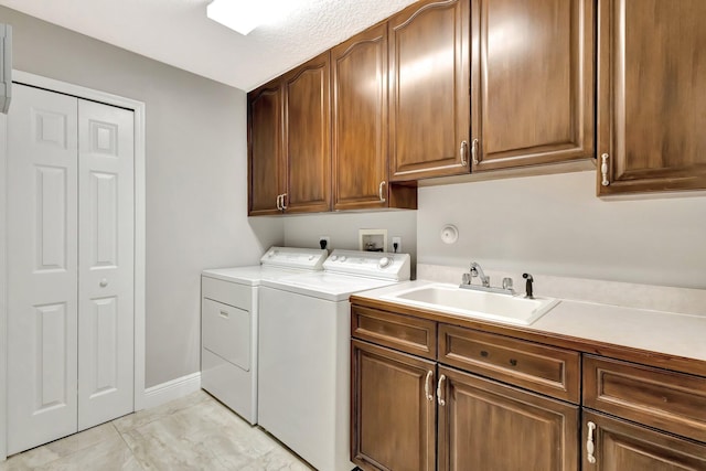 4610 Bucida Rd, Boynton Beach, FL 33436 - laundry area with cabinet space, washing machine and clothes dryer, and baseboards