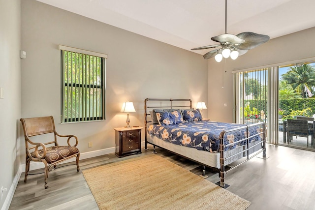 4610 Bucida Rd, Boynton Beach, FL 33436 - bedroom featuring access to exterior, light wood-style flooring, baseboards, and ceiling fan