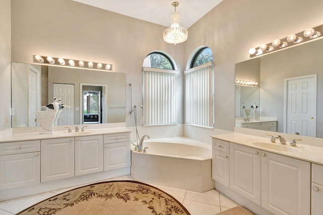 4610 Bucida Rd, Boynton Beach, FL 33436 - full bath featuring a bath, two vanities, tile patterned flooring, and a chandelier