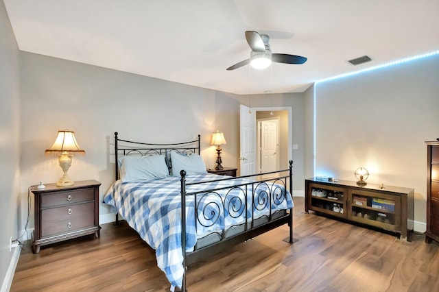 4610 Bucida Rd, Boynton Beach, FL 33436 - bedroom with wood finished floors, baseboards, and ceiling fan