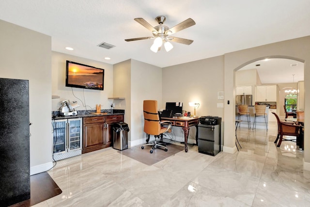 4610 Bucida Rd, Boynton Beach, FL 33436 - office featuring beverage cooler, arched walkways, ceiling fan, and baseboards