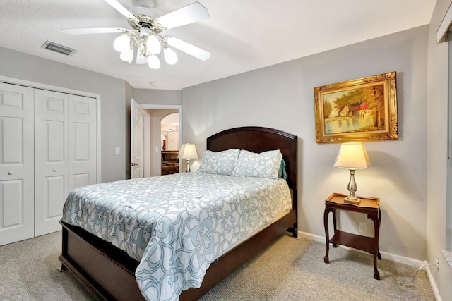 4610 Bucida Rd, Boynton Beach, FL 33436 - bedroom with carpet, a closet, ceiling fan, baseboards, and arched walkways