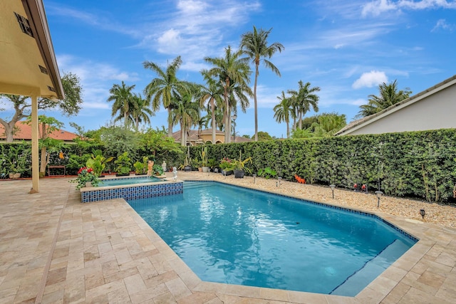 4610 Bucida Rd, Boynton Beach, FL 33436 - view of swimming pool with a patio area, a fenced backyard, and a pool with connected hot tub