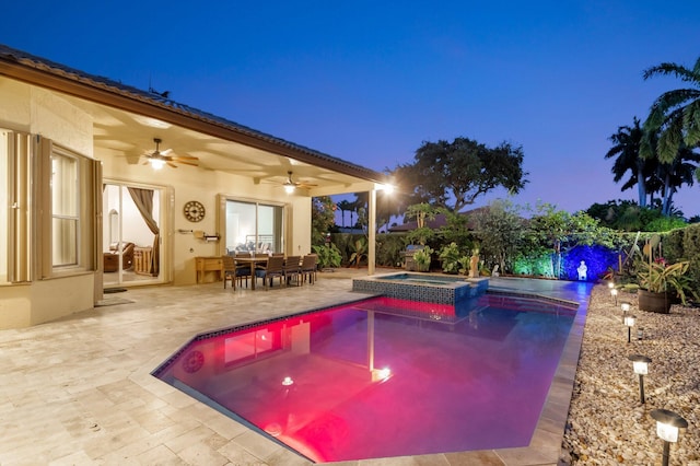 4610 Bucida Rd, Boynton Beach, FL 33436 - pool at twilight featuring ceiling fan, a patio, outdoor dining space, and a pool with connected hot tub