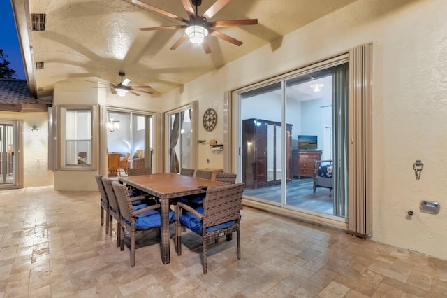 4610 Bucida Rd, Boynton Beach, FL 33436 - dining space with a textured wall, stone tile floors, and ceiling fan