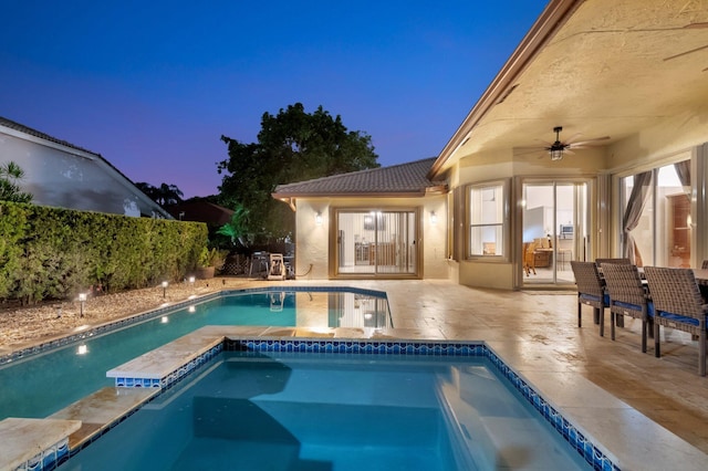 4610 Bucida Rd, Boynton Beach, FL 33436 - pool at dusk featuring a ceiling fan and a patio area