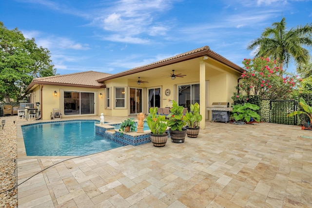 4610 Bucida Rd, Boynton Beach, FL 33436 - view of swimming pool with a ceiling fan, a patio area, a grill, and a pool with connected hot tub