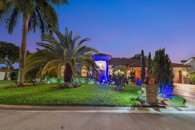 4610 Bucida Rd, Boynton Beach, FL 33436 - view of front facade with an attached garage, driveway, and a front lawn