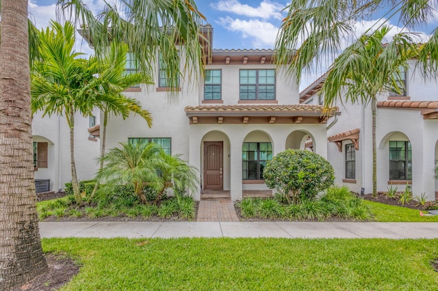 13291 Machiavelli Way, Palm Beach Gardens, FL 33418 - mediterranean / spanish home with a tile roof, stucco siding, and a front yard