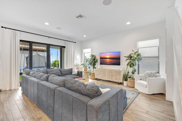 13291 Machiavelli Way, Palm Beach Gardens, FL 33418 - living area with light wood-style flooring and recessed lighting